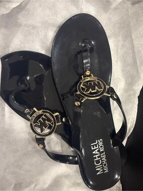 Michael Kors Black Patent Jelly Thong Sandals with Gold MK Medallions